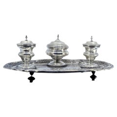 Silver inkwell with three engraved tanks, bell 
tray on claw feet