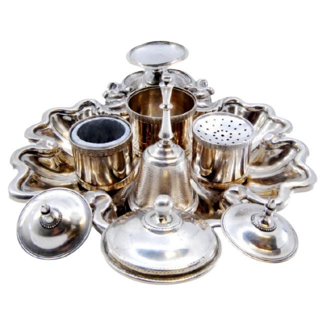 Silver inkwell with three reservoirs, bell 
shell-based claw feet