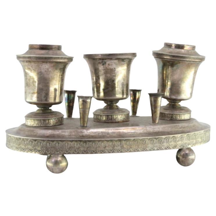 Silver inkwell with three reservoirs, guilloche pen holders 
ball feet