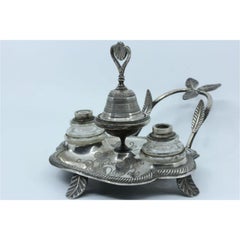 Silver inkwell with two tanks and relief applications with a bell