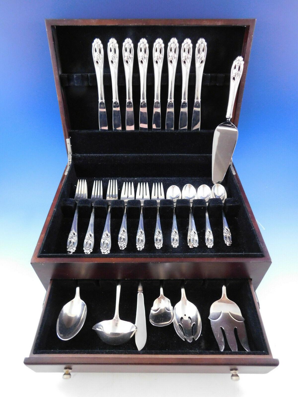 Silver Iris by International sterling silver flatware set with pierced handles and high relief iris detailing - 39 pieces. This set includes:

8 knives, 9 1/4