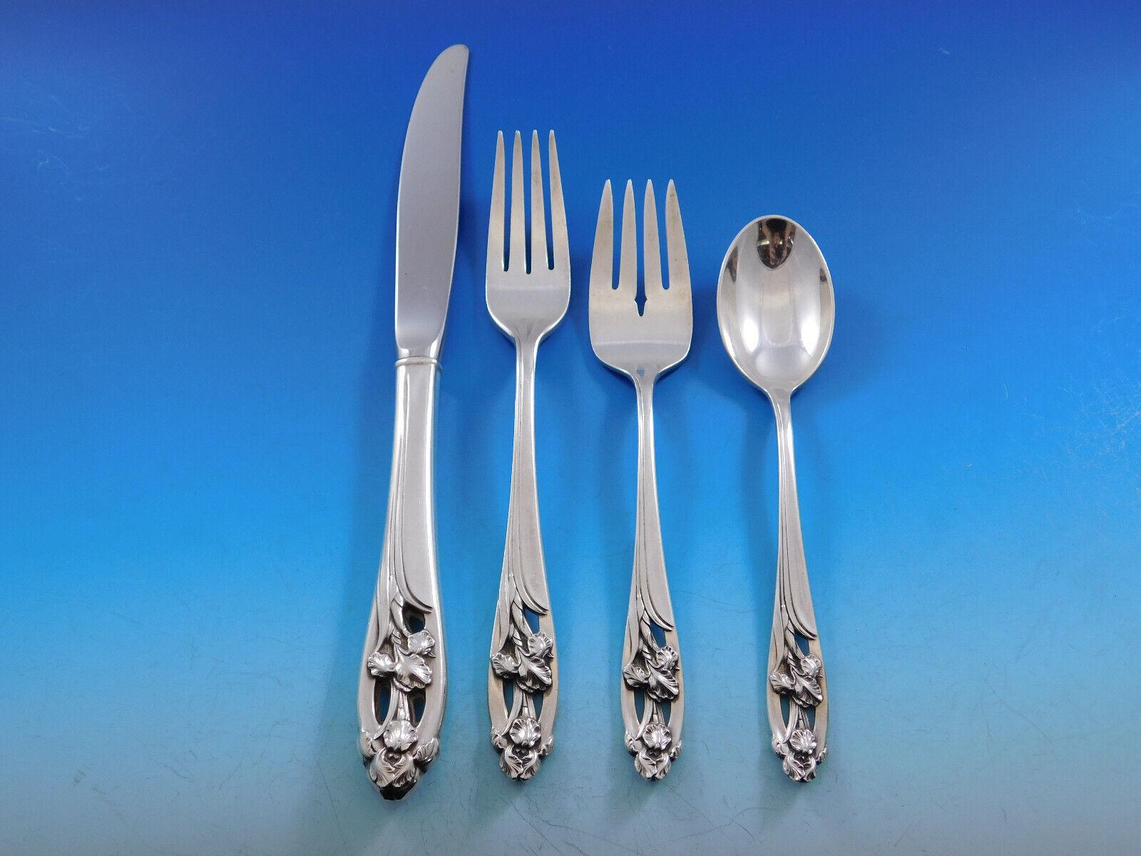 Gorgeous Silver Iris by International sterling silver flatware set with pierced handles and high relief iris detailing - 43 pieces. This set includes:

8 Knives, 9 1/4