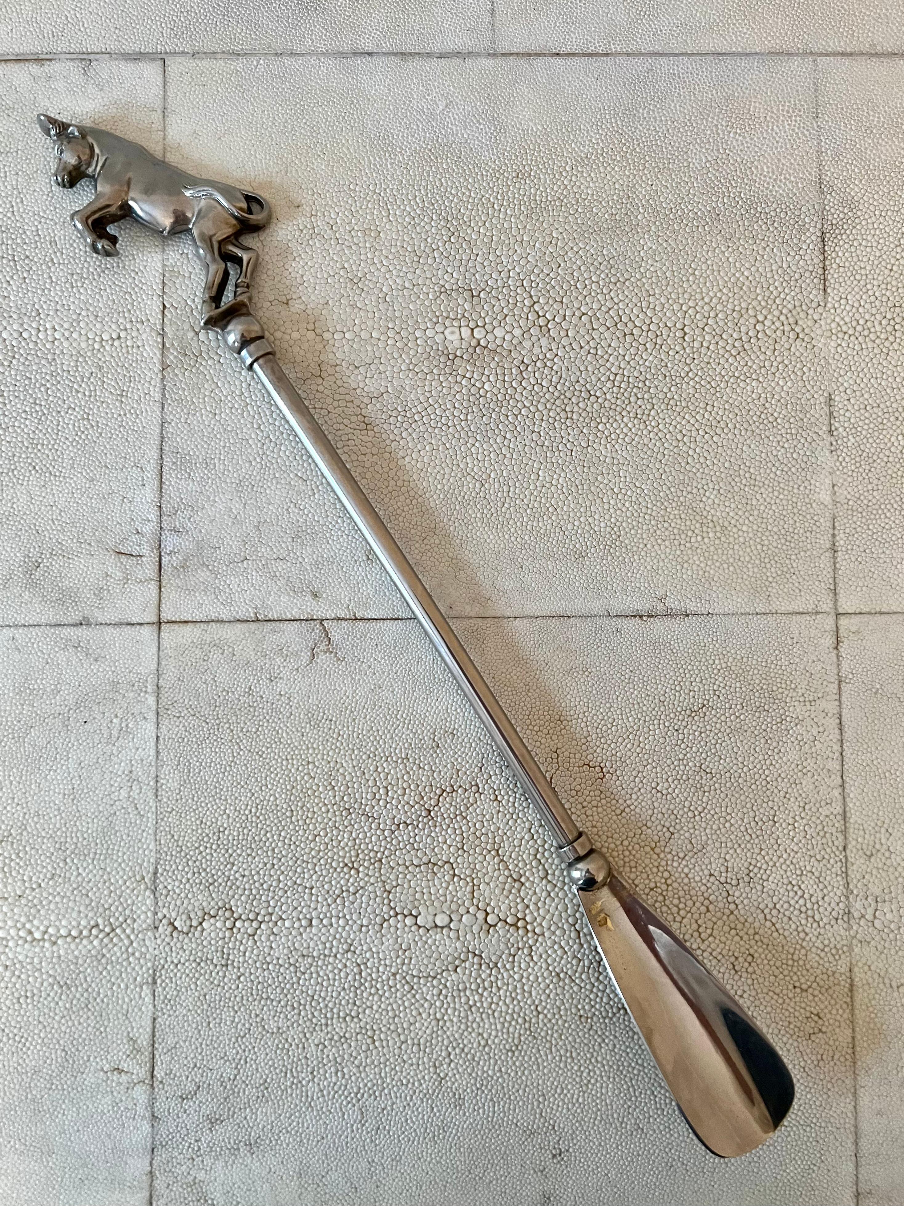Unique silver shoehorn made in Italy with bull figure on the handle. Bull has been a symbol of fertility and power since prehistoric times. 

Stamped 