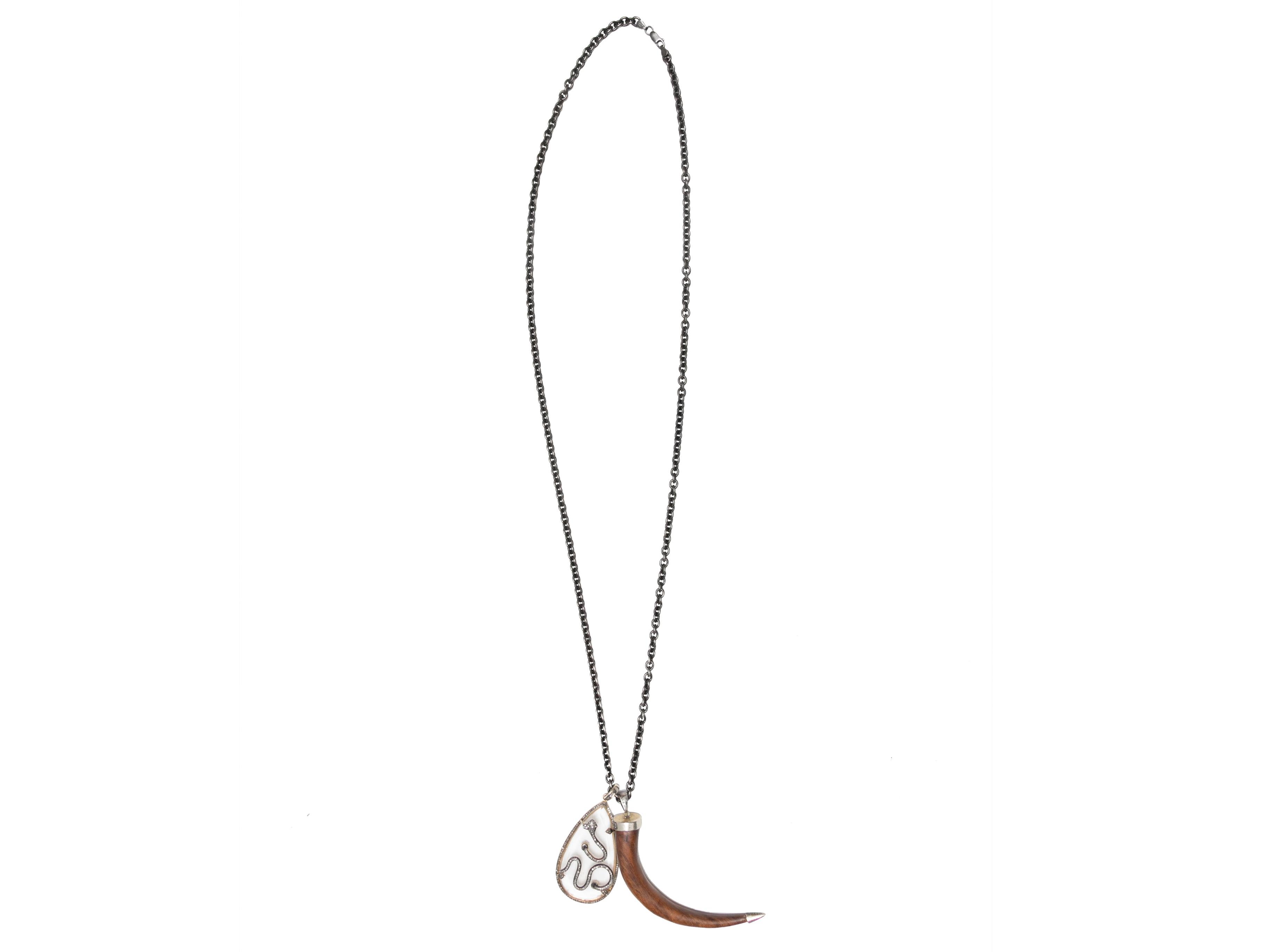  Silver snake motif pave diamond horn pendant necklace by Jennifer Miller. Lobster claw clasp closure. 1.5