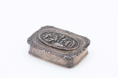 Silver jewelry box with bucolic scene reliefs on the lid