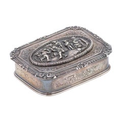Silver jewelry box with bucolic scene reliefs on the lid