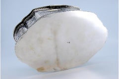 Silver jewelry box with edge friezes, plant engravings and ancient lady