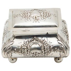 Silver jewelry box with embossed floral motifs