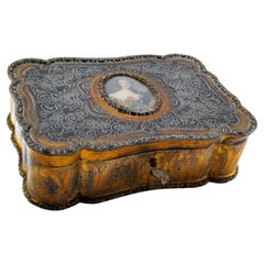 Used Silver jewelry box with engraved plant motifs surrounding an ancient lady