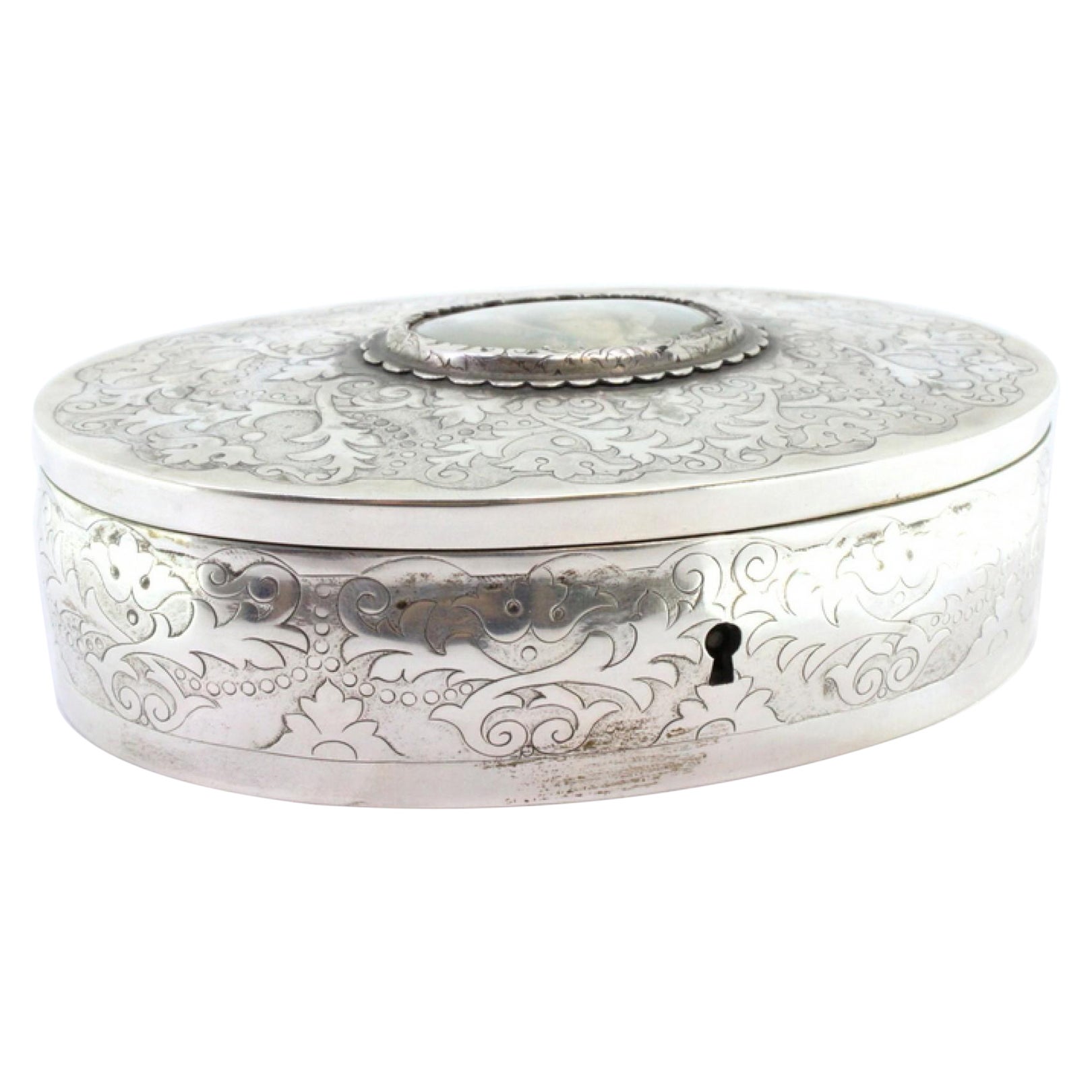 Silver jewelry box with plant engravings and young-lady card