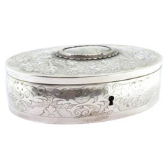 Silver jewelry box with plant engravings and young-lady card