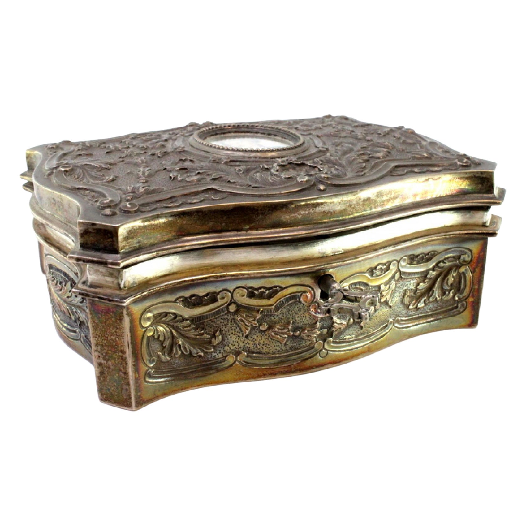 Silver jewelry box with raised florals and antique-lady card, keyed lid