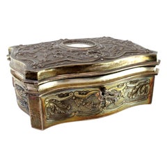 Silver jewelry box with raised florals and antique-lady card, keyed lid
