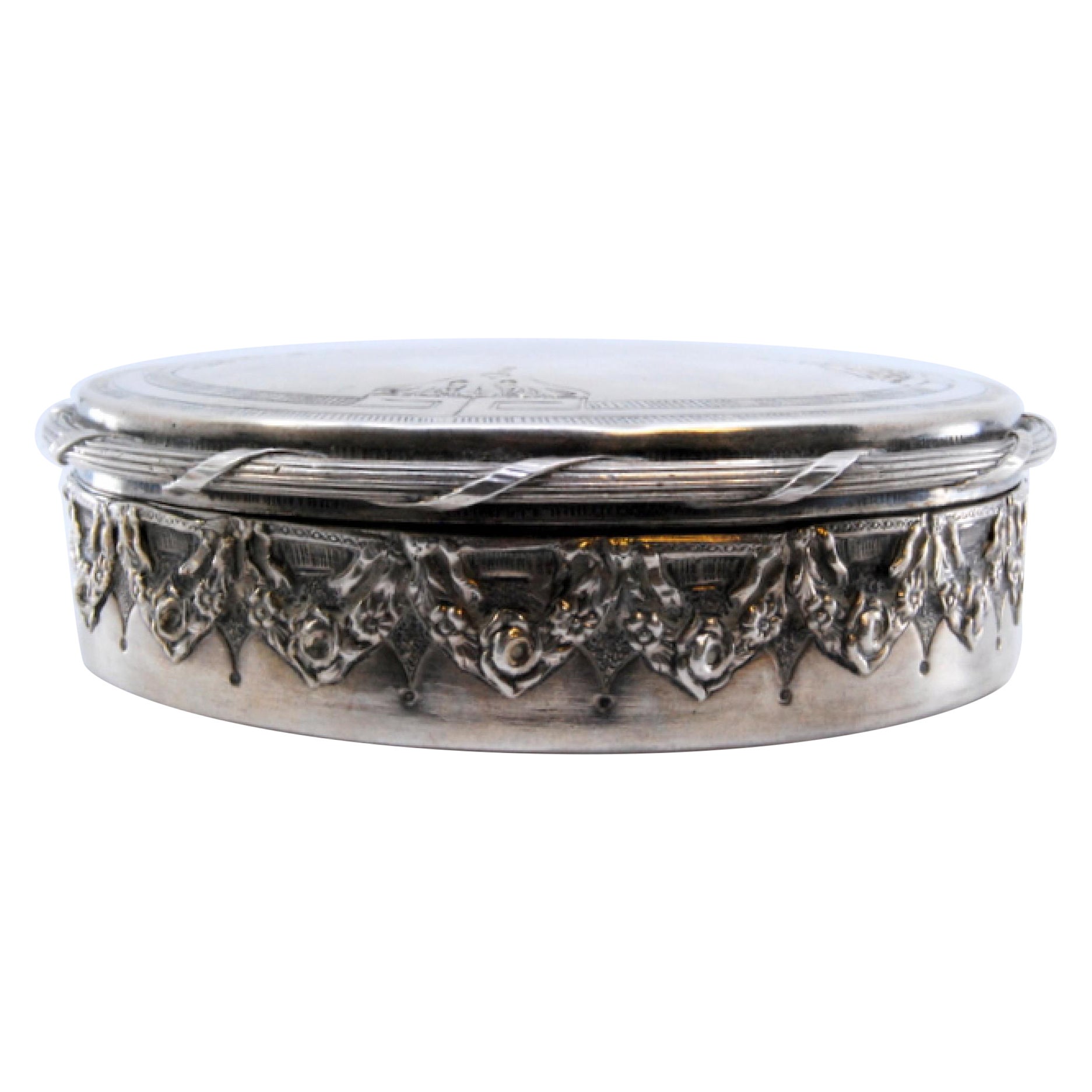Silver jewelry box with relief casing, gold interior and plant engravings
