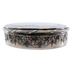 Silver jewelry box with relief casing, gold interior and plant engravings