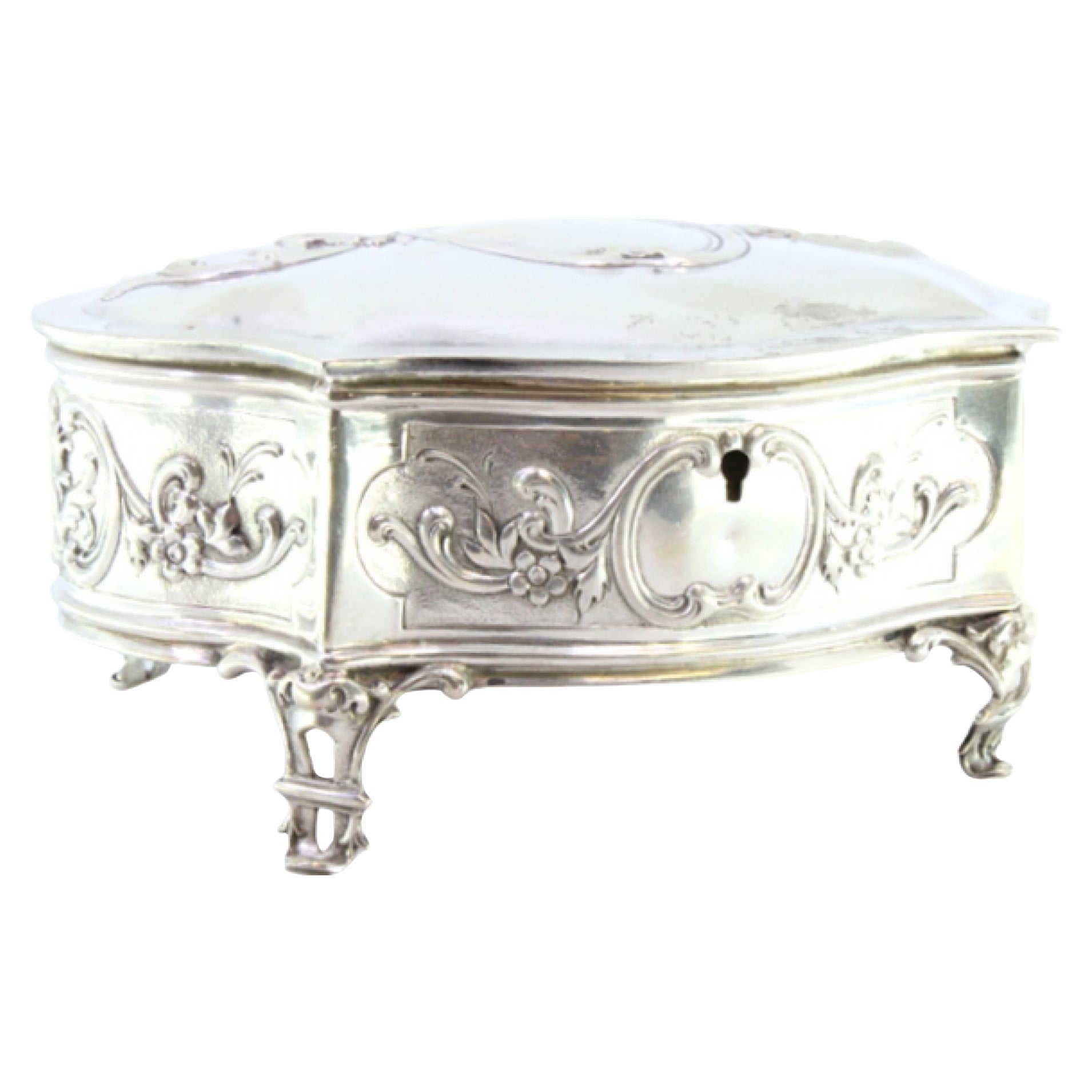 Silver jewelry box with relief plant motifs and resting on four openwork feet