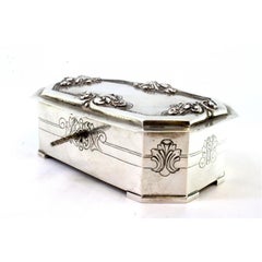 Silver jewelry box with reliefs and engravings on the lid