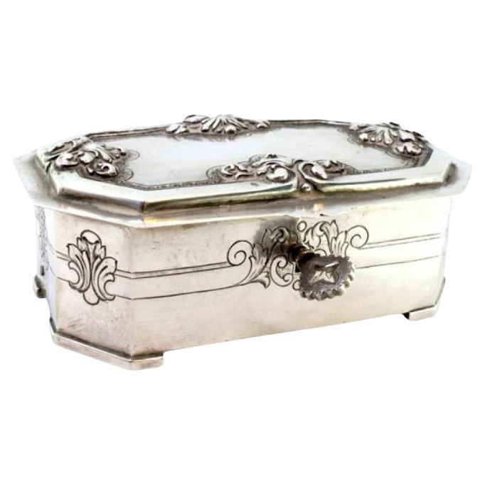 Silver jewelry box with reliefs and engravings on the lid