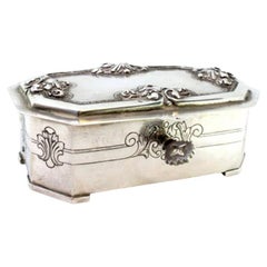 Silver jewelry box with reliefs and engravings on the lid Silver jewelry box with reliefs and engravings on the lid
