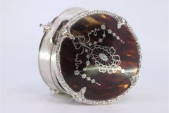 Silver jewelry box with tortoiseshell lid, friezes and fleur-de-lis feet