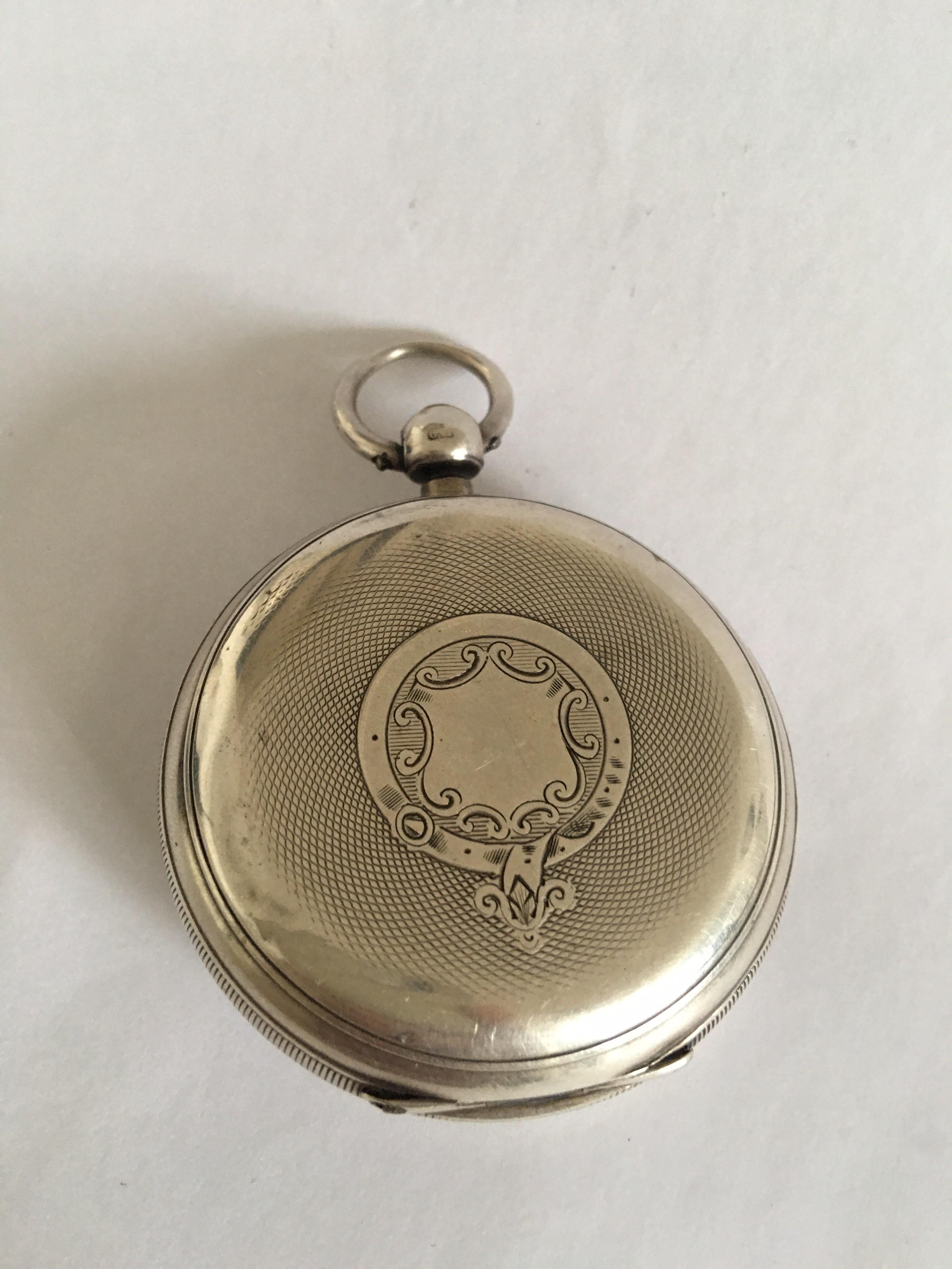 This watch is in good working condition and has been serviced. Tiny crack on the bottom dial and some dents on the back cover silver case as shown.

Please study the images carefully as form part of the description.