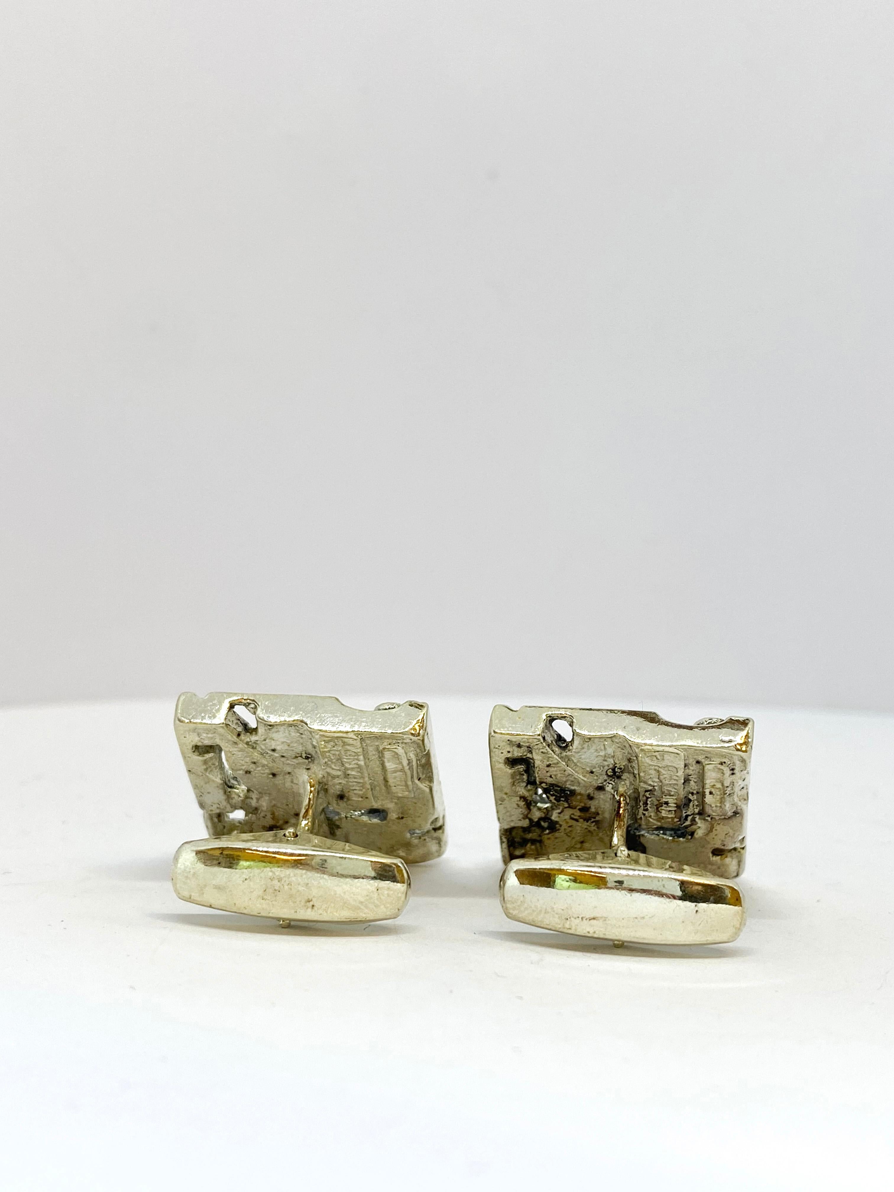 Silver Jorma Laine Turun Hopea 1976 Cufflinks
830 Silver.
Made in Finland Turun Hopea.

Jorma Laine (1930-2002) was a Finnish jewelry designer, whose work in bronze and silver (more seldom gold) is easily recognizable. He developed a style of his