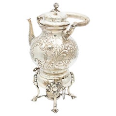 Silver kettle with embossed floral motifs