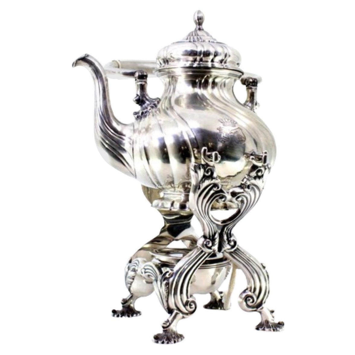 Silver kettle with fluted reliefs on lamp stand and four raised feet