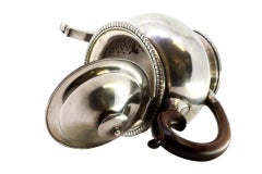 Silver kettle with raised friezes, hinged lid with wood knob and handle