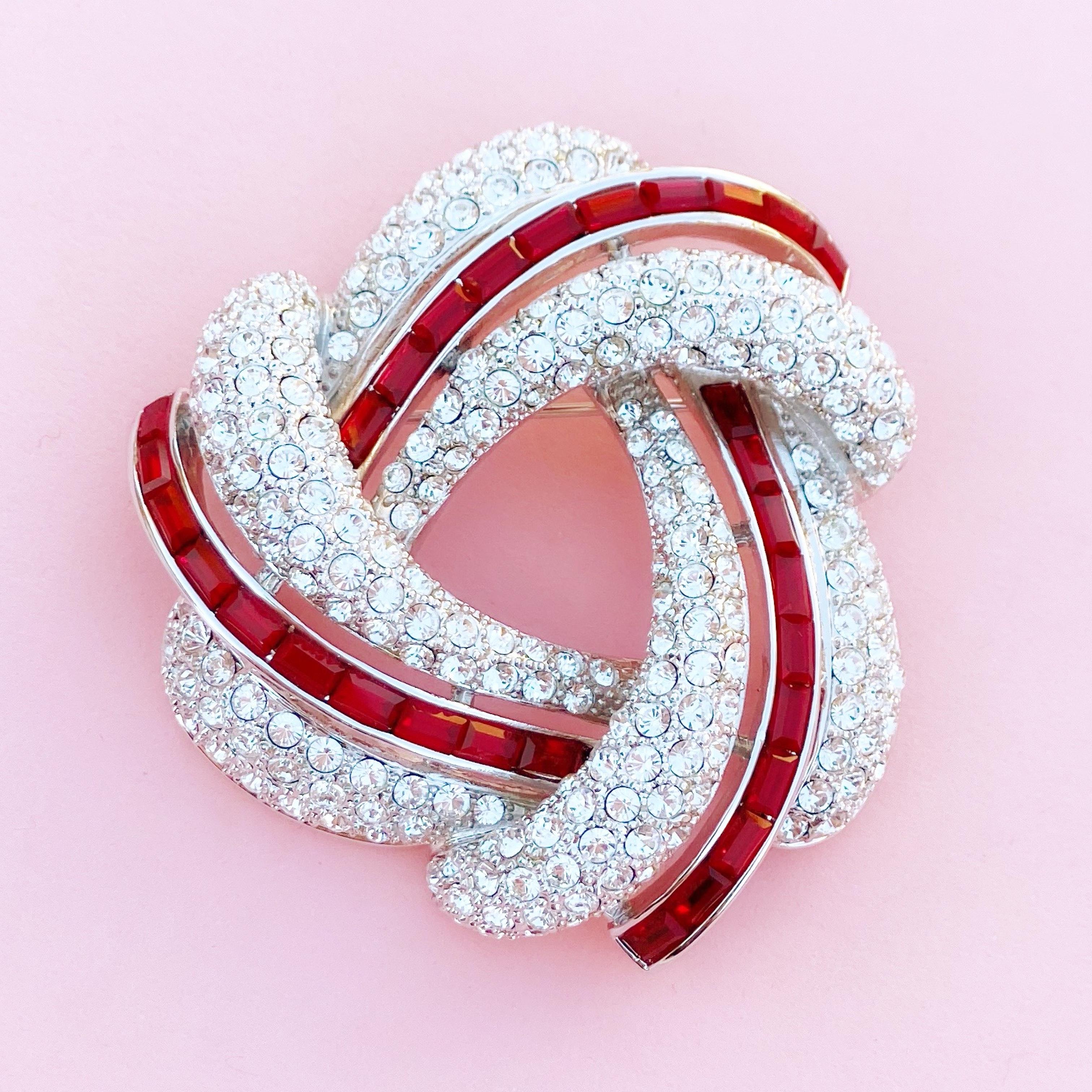 Modern Silver Knot Brooch w Crystal Pavé & Red Crystal Baguettes by Nolan Miller, 1990s