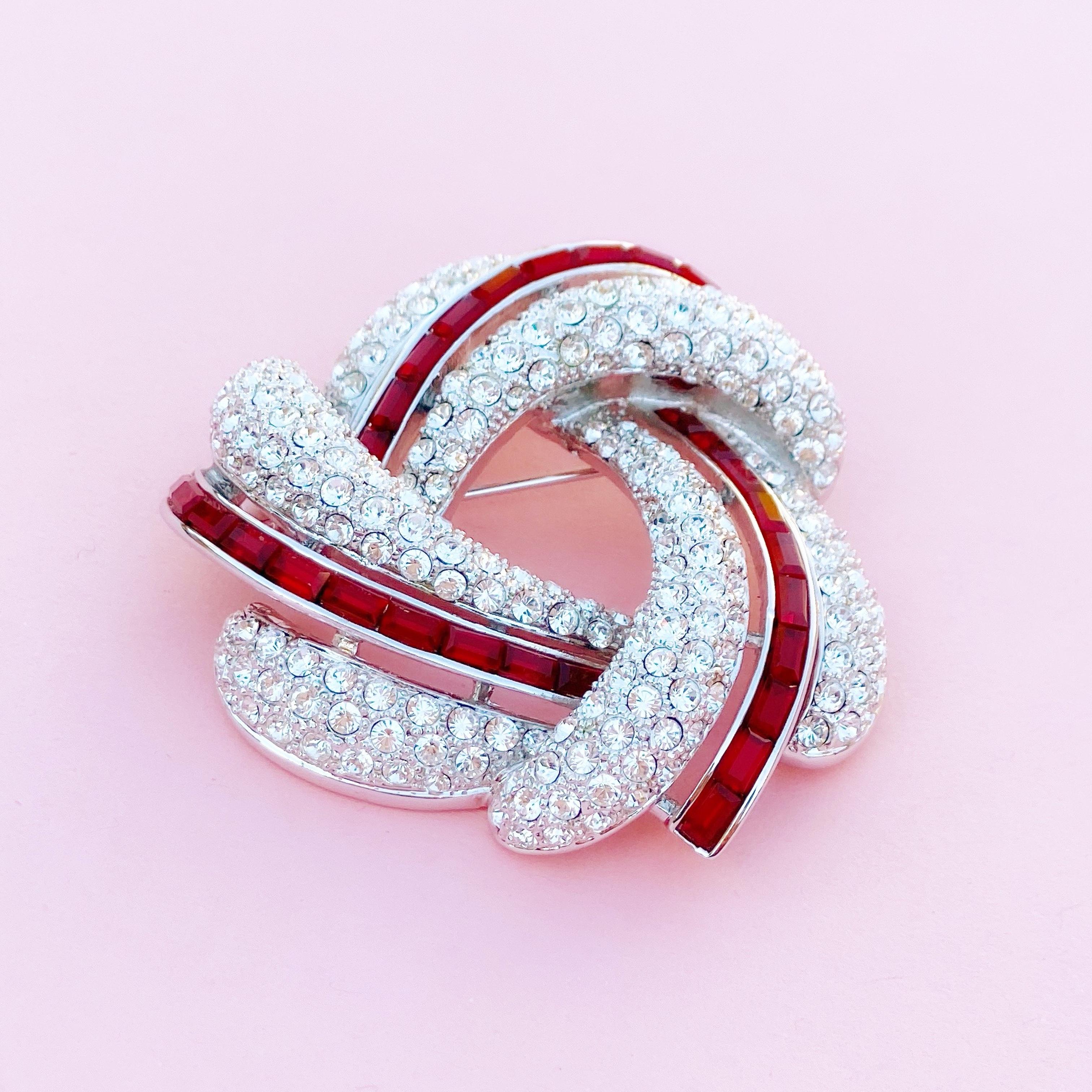 Silver Knot Brooch w Crystal Pavé & Red Crystal Baguettes by Nolan Miller, 1990s In Excellent Condition In McKinney, TX