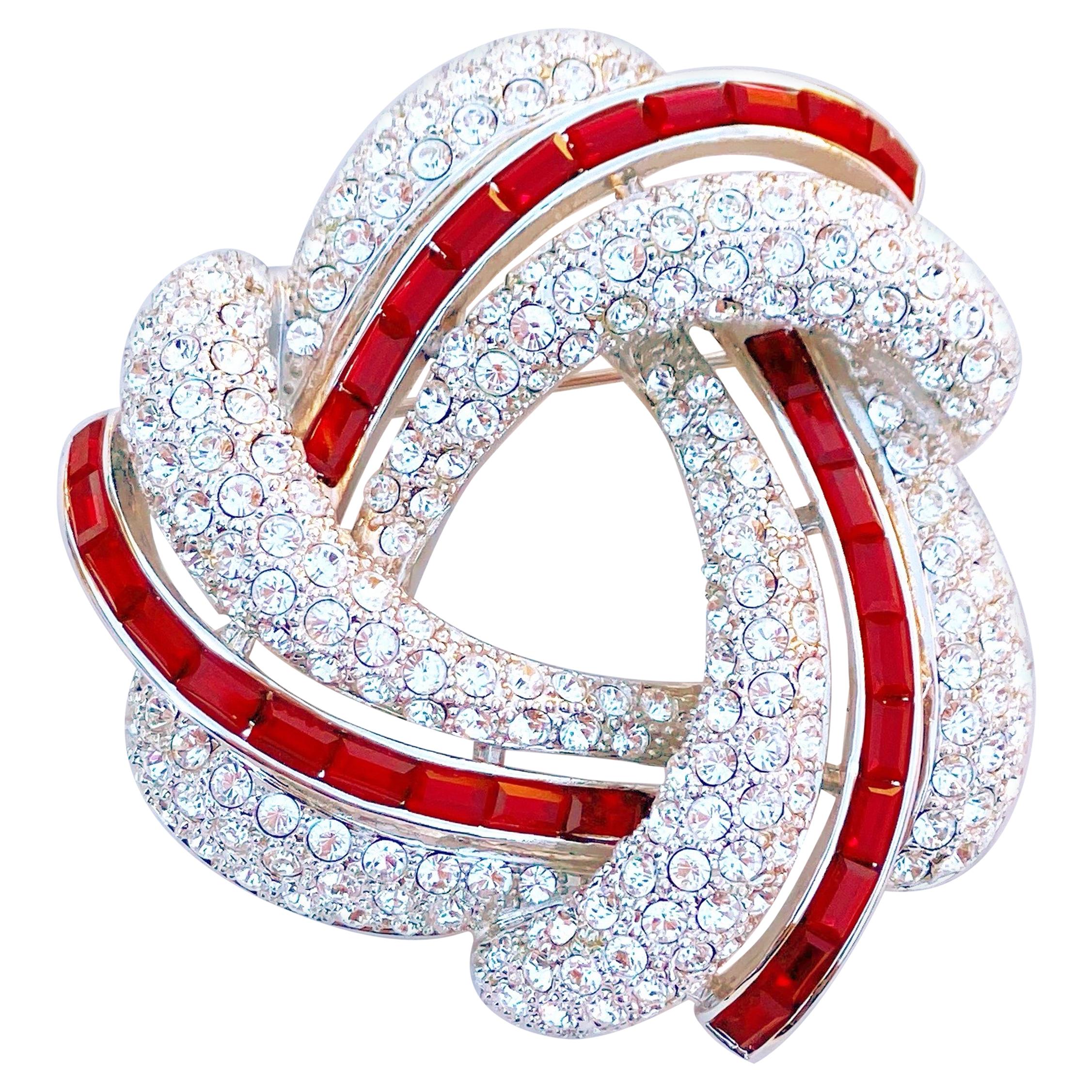 Silver Knot Brooch w Crystal Pavé & Red Crystal Baguettes by Nolan Miller, 1990s