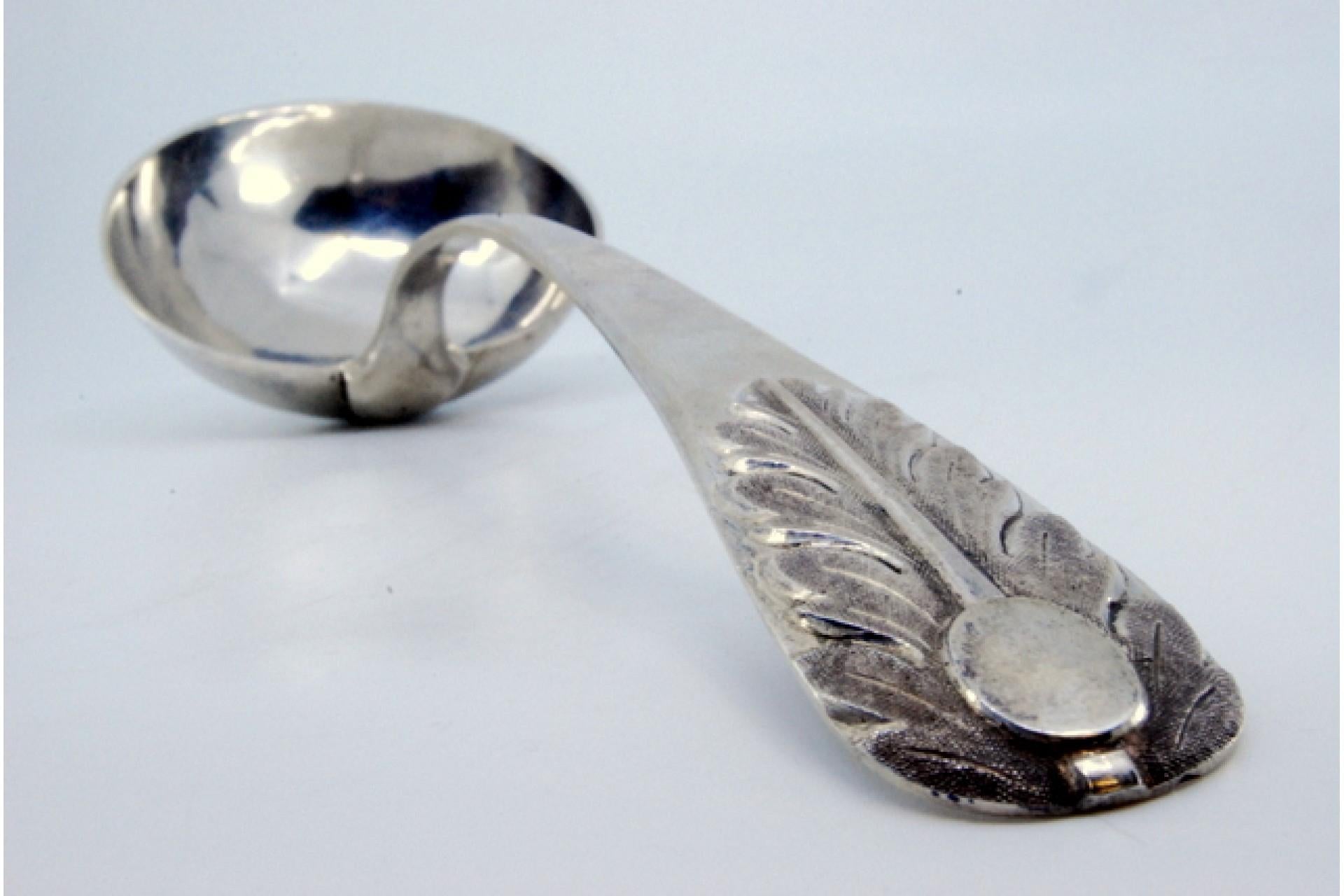 European Silver ladle with relief handle and acanthus leaf monogram cartouche For Sale