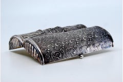 Silver lady's pin box with reliefs on both sides and a gold interior