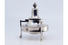 Silver lamp with pearly surround and flame cover topped with a knob