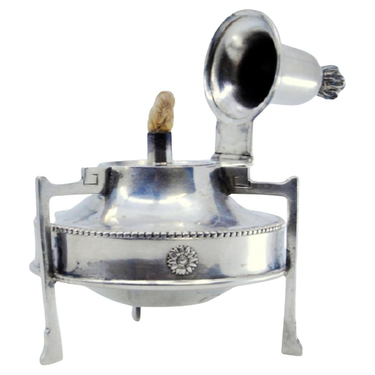 Silver lamp with pearly surround and flame cover topped with a knob For Sale