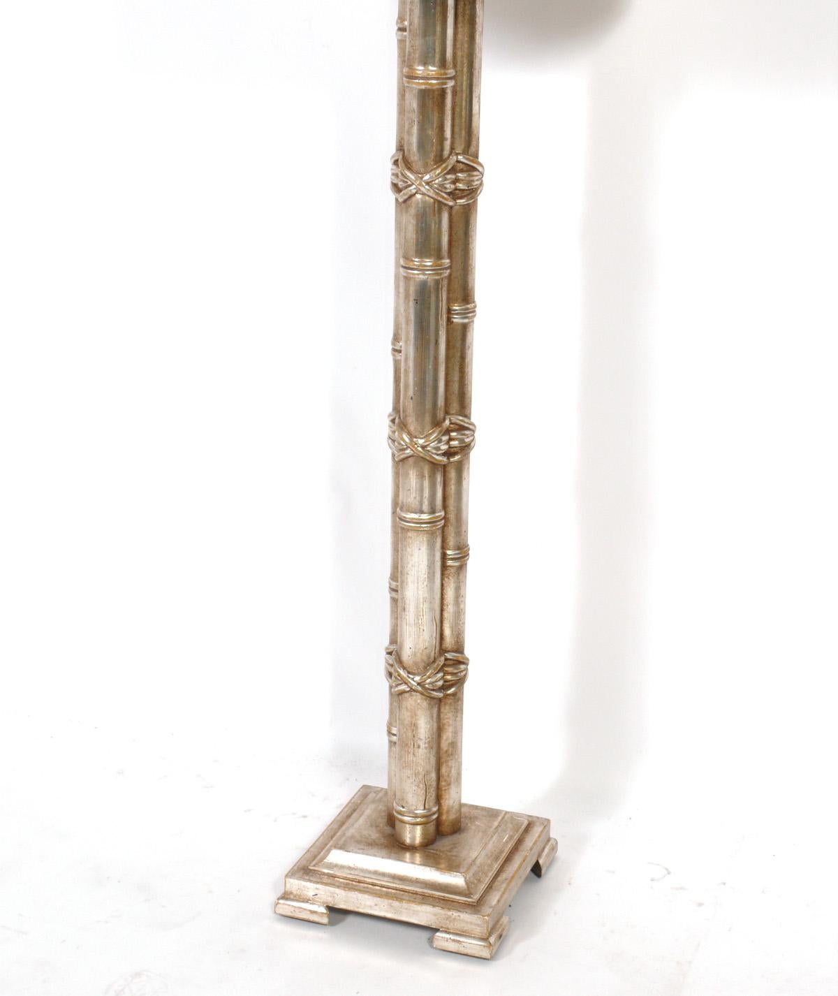Silver leaf bamboo form floor lamp, designed by Nancy Corzine, American, circa 2000s. The price noted includes the shade.
