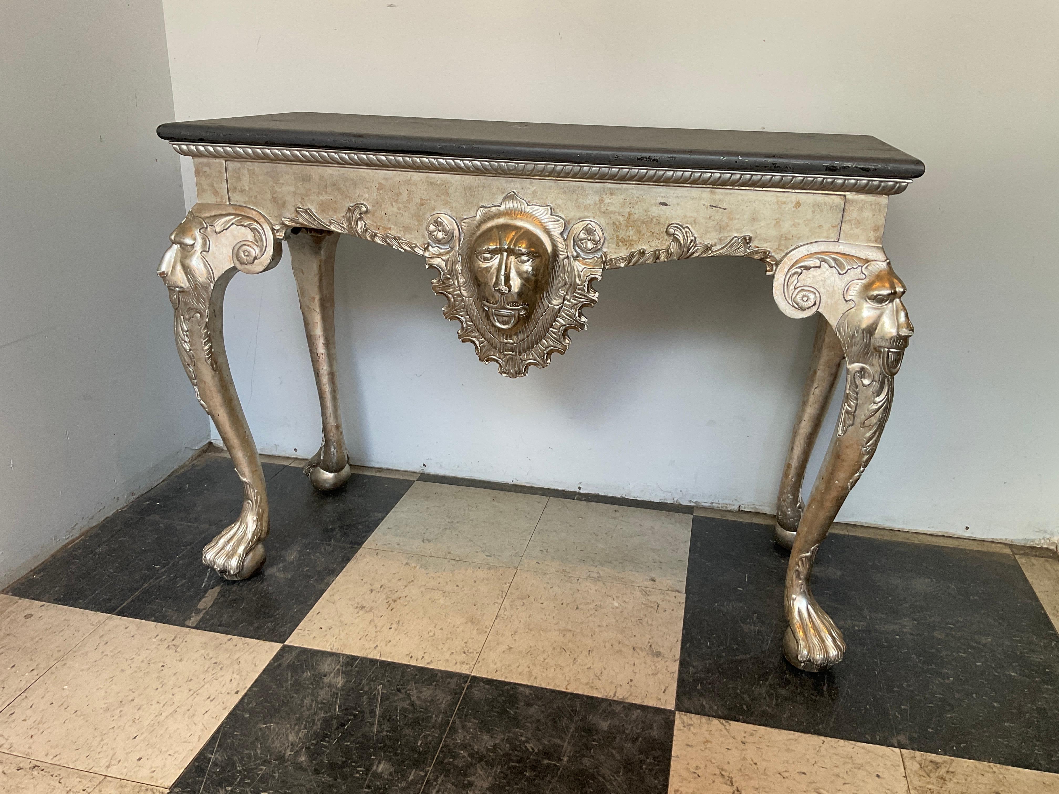 Hand carved wood lion console, silver leaf finish. Top is distressed, some silver leaf gone, as shown in pictures.