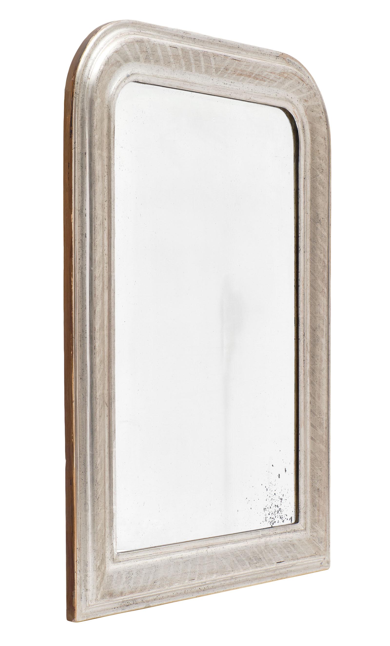 Louis Philippe period silver leaf mirrors. This pair has finely chiseled frames and a beautiful patina.