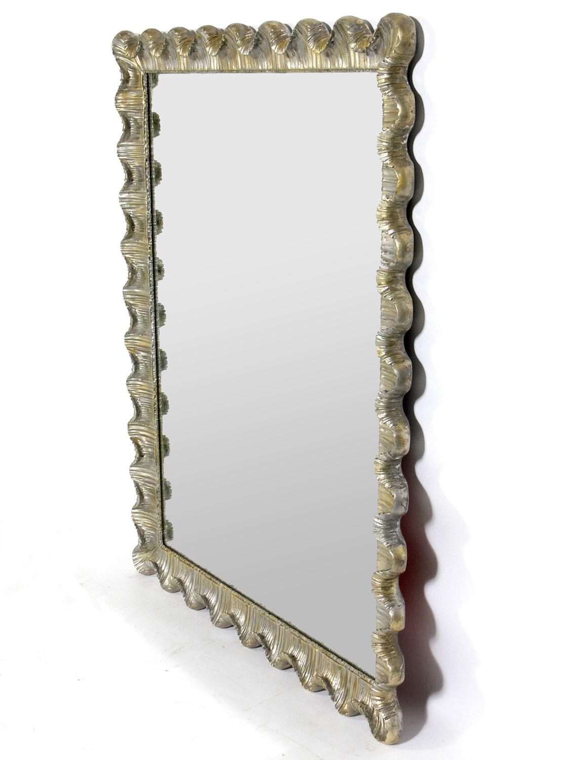 Silver leaf scalloped mirror, Italy, circa 1950s. Retains wonderful original patina to both the silver leafed scalloped wood and gesso frame and the original mirrored glass.