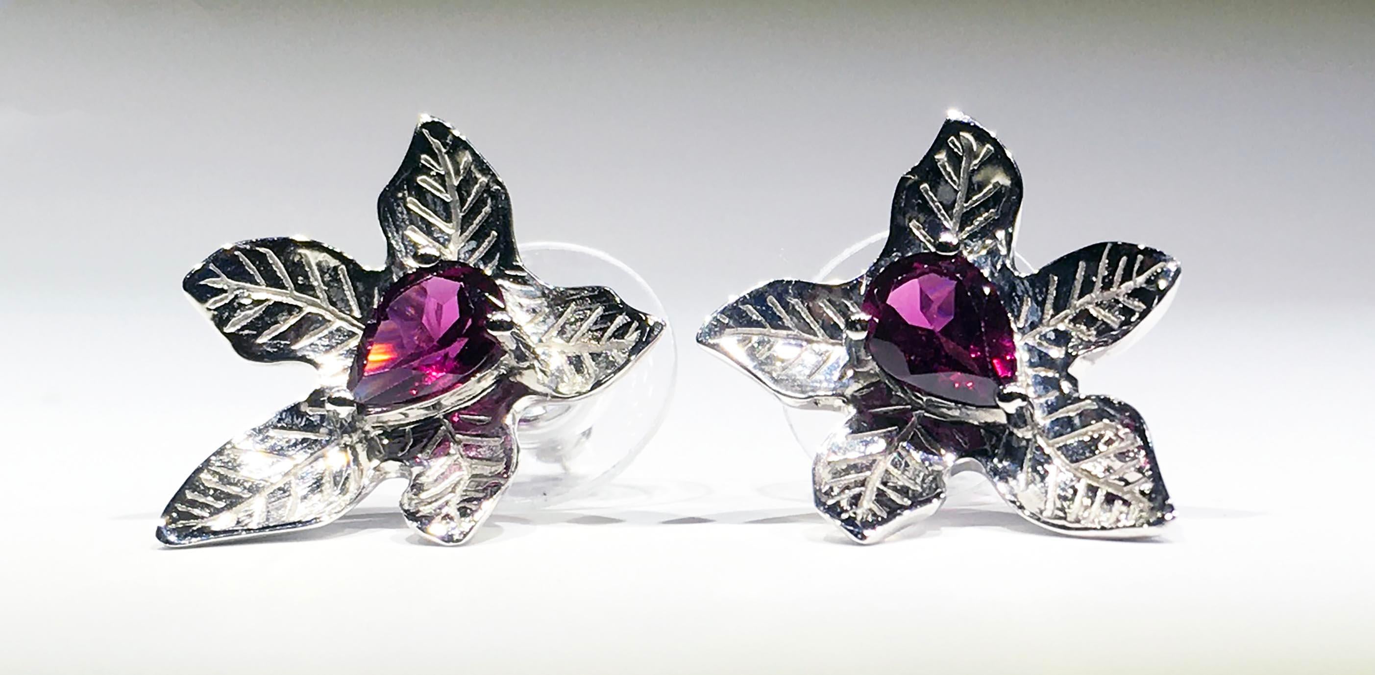 A lovely pair of Silver Leaf Stud Earrings set with Pear Shaped Rhodolite Garnets TW 1.6 Carats. These Earrings are Plated with Rhodium for that nice White Shine. 

Originally from San Diego, California, Kary Adam lived in the “Gem Capital of the