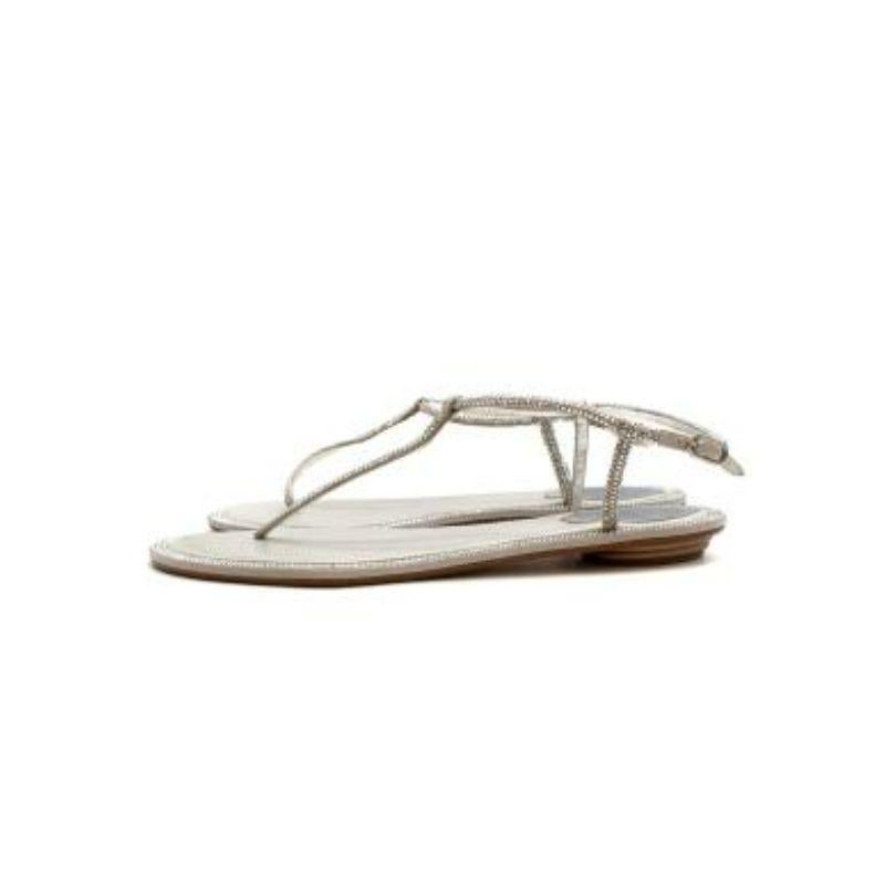 Rene Caovilla silver leather crystal embellished Diana thong sandals
 
 - Silver leather thong sandals with mini crystals adorning the straps
 - Grey leather-lined footbed 
 - Adjustable buckled ankle strap
 - Rubber sole
 
 Materials
 Rubber 
