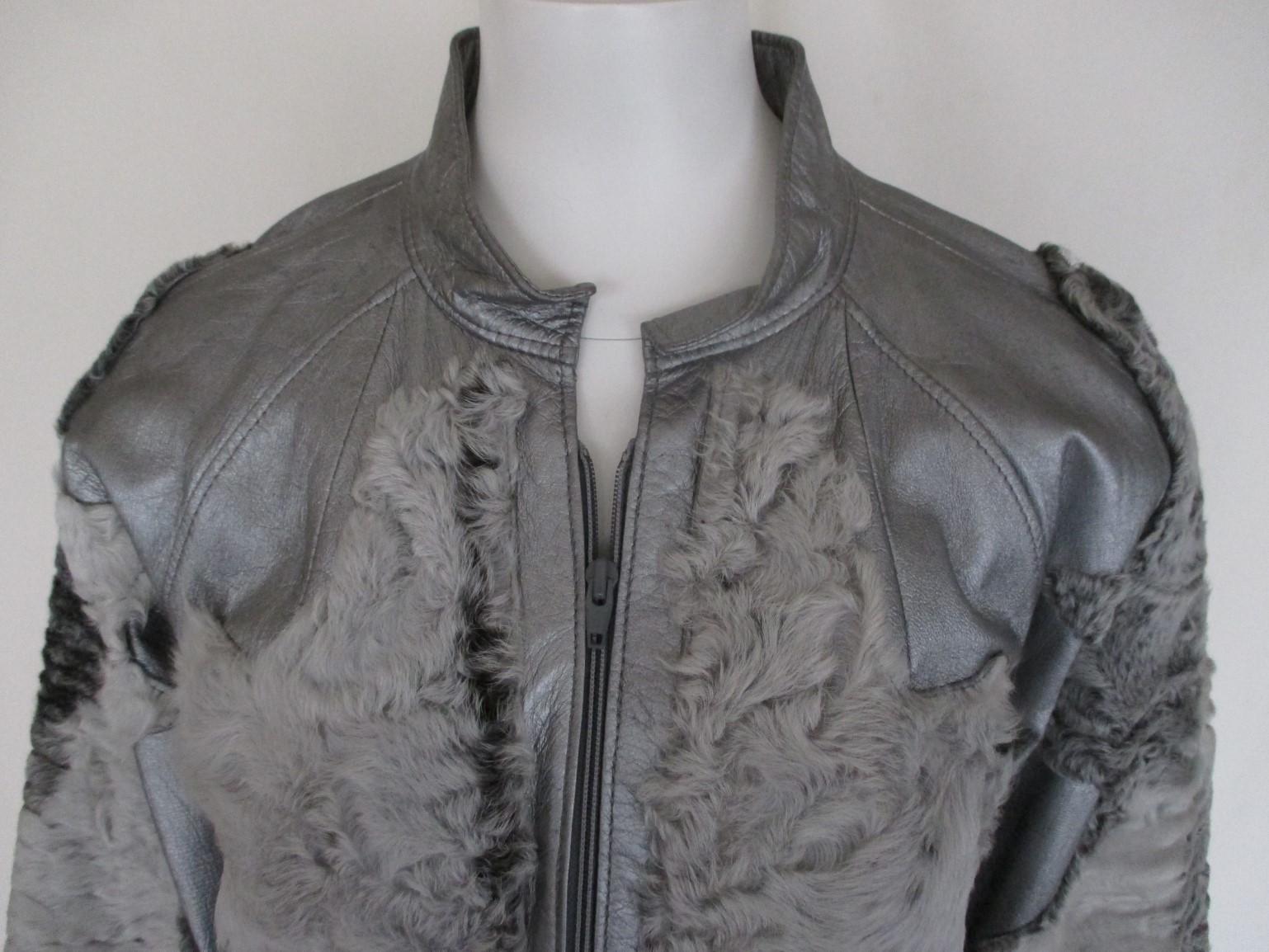 This vintage jacket is made from leather designed with persian Lamb fur.
Color: silver
in pre-owned condition, some little spots on the leather, see photos.
It has 2 pockets and a zipper.
size is about small to medium
Please note that vintage items
