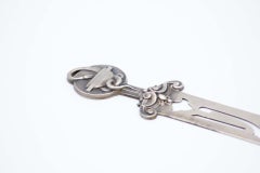 Silver letter opener cut into the blade