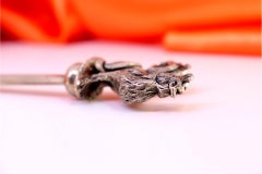 Silver letter opener with a perfectly shaped rooster on the handle