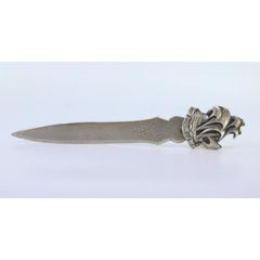 Silver letter opener with high relief of the Caravel St. Michael on the handle