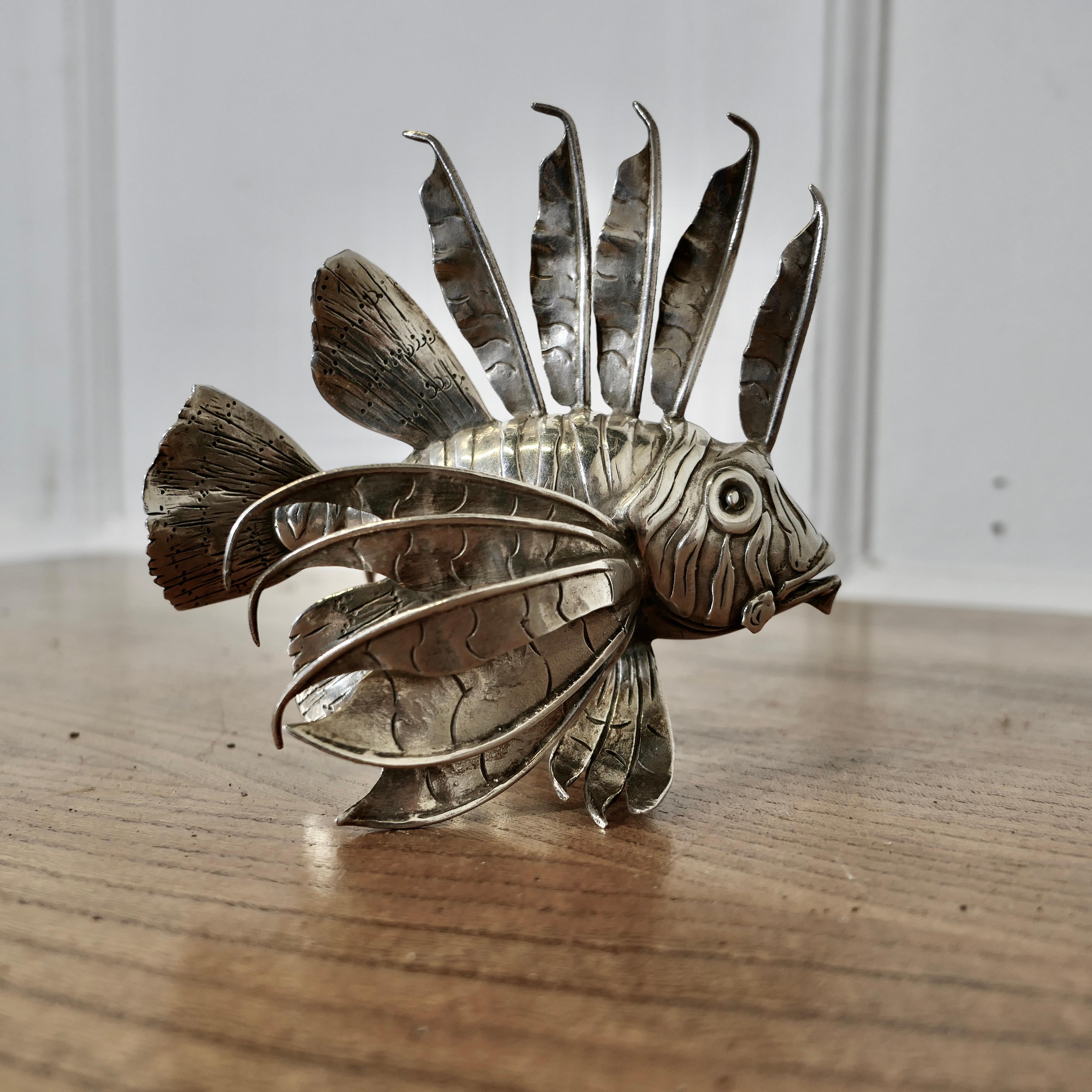 Silver Lion Fish Model Signed by  Mario Bucellati

A fine piece from one of the most prestigious jewellers of the world, this realistic freestanding model is made by and signed Mario Bucellati
The Fish is 4.5” in height and length and 3.5”
