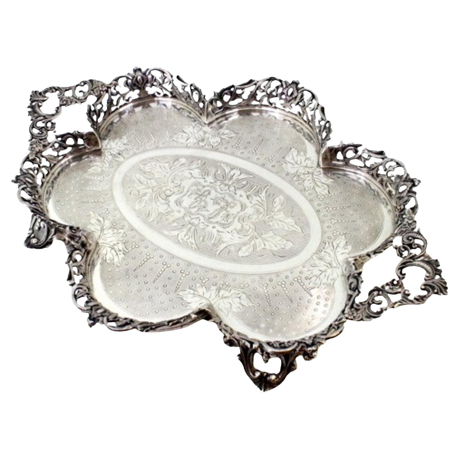 Silver lobed salver with guilloche grid 
4 openwork feet