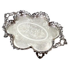 Silver lobed salver with guilloche grid 
4 openwork feet