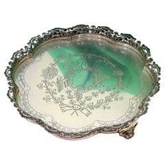 Silver lobed salver with scalloped guilloche grid 
3 openwork feet